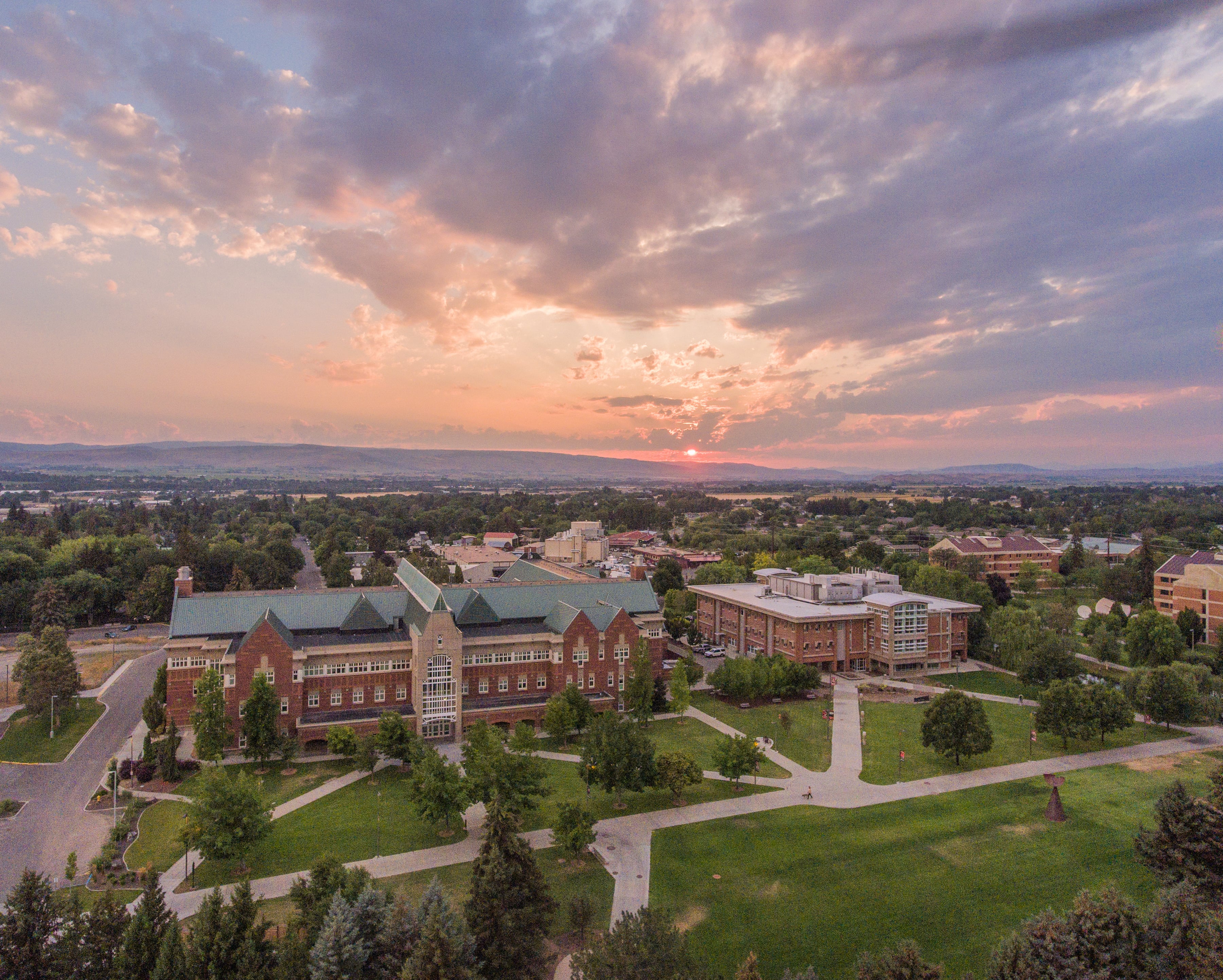Aerial view of Central Washington University’s Ellensburg campus, highlighting campus buildings set against the surrounding landscape.