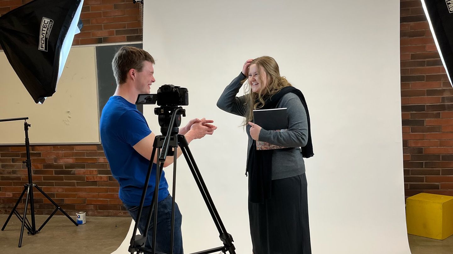 Two students within the communication program at Central Washington University share a laugh.