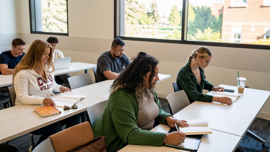 Six students within the educational foundations program at Central Washington University study attentively.