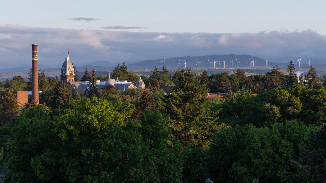 Photo shows top of Barge and other CWU buildings with a background of the windmills in the far behind