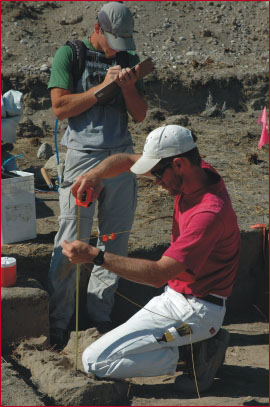 Student Miles Muscato and Dr. Patrick Lubinski measuring depths