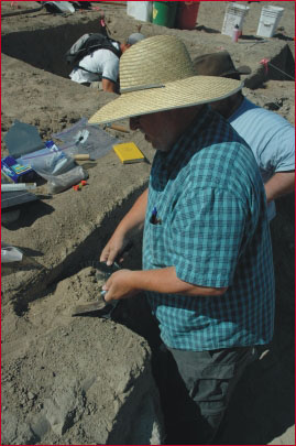 Bax Barton collecting bulk sediment samples for water screening