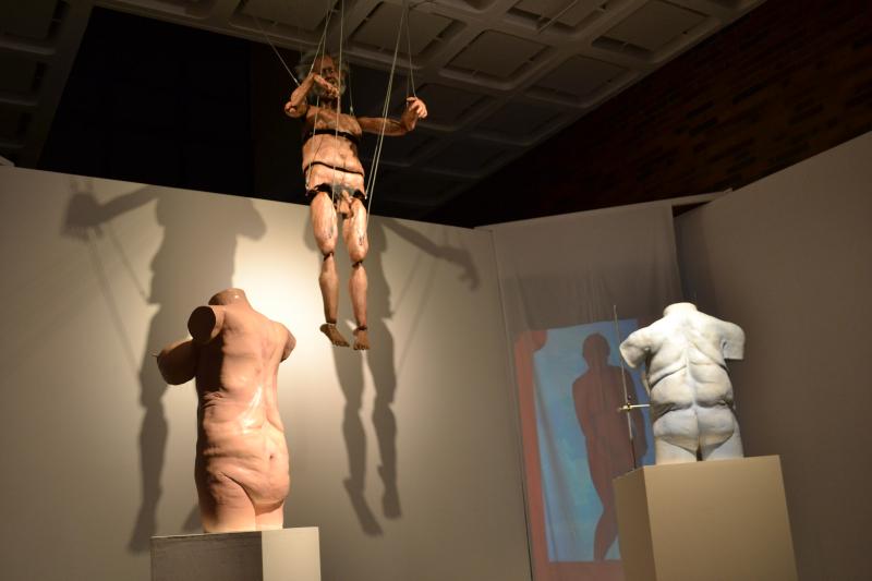 multiple human busts and puppets