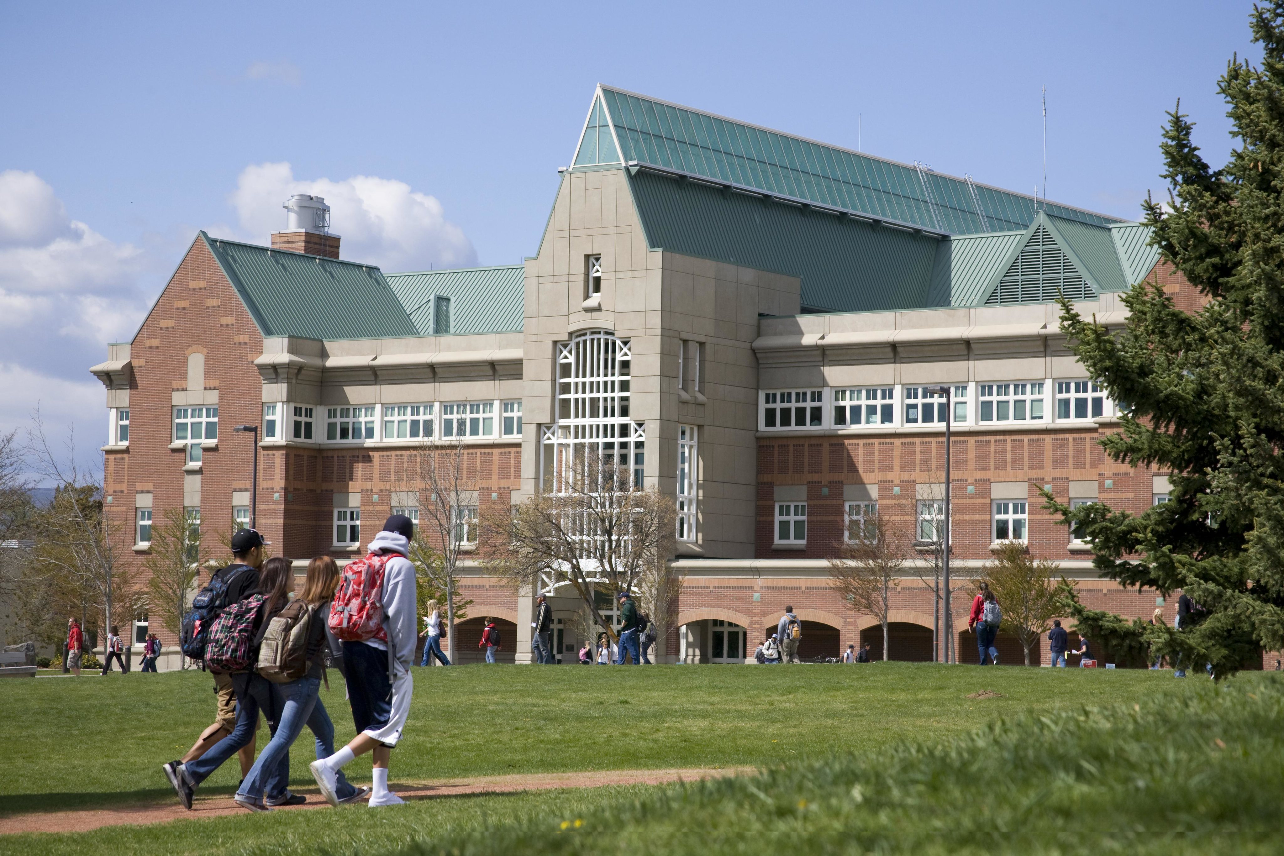 Exterior of CWU Science Building with students walking in front of it.