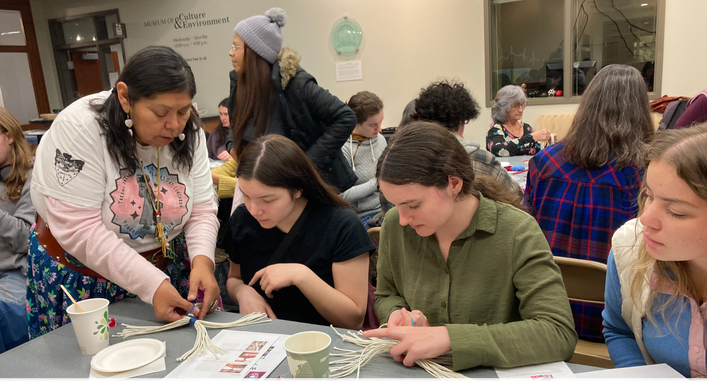 Students working on basket weaving during a demonstration