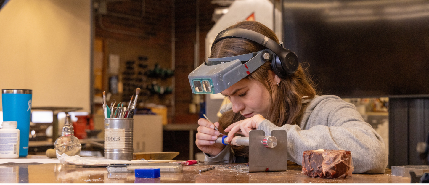 Student creating jewelry 
