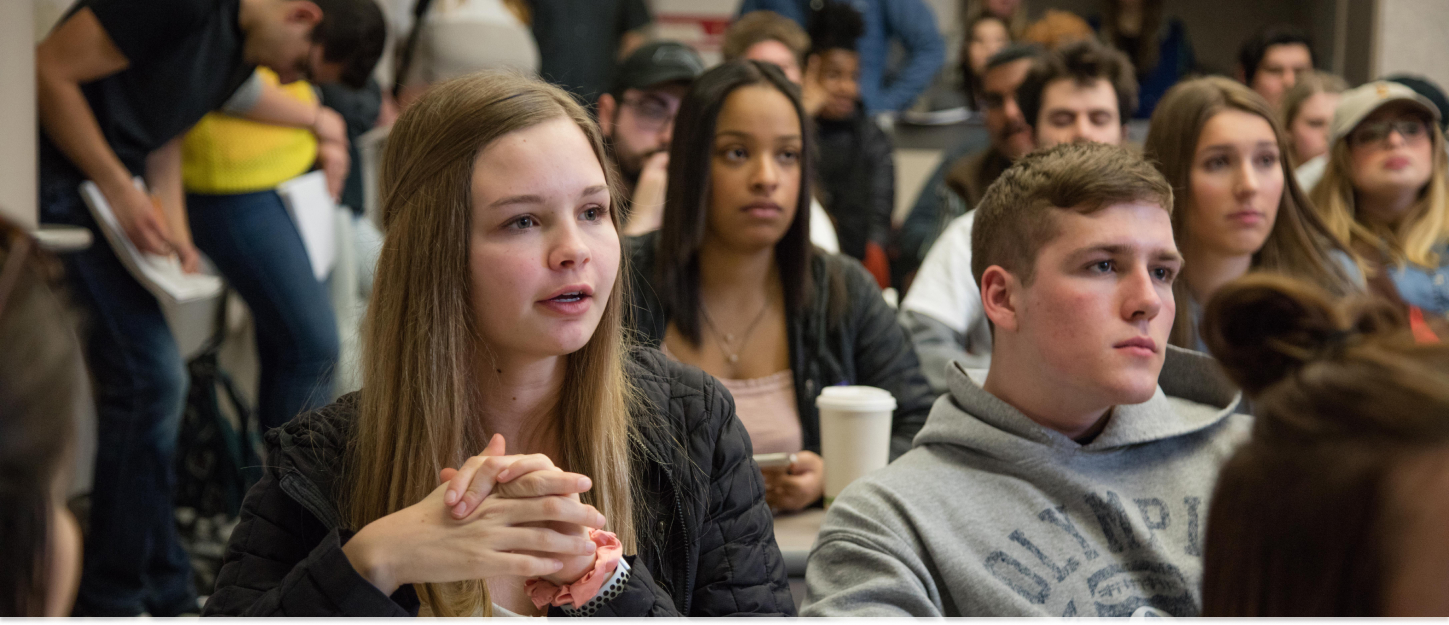 Student speaking in class. 