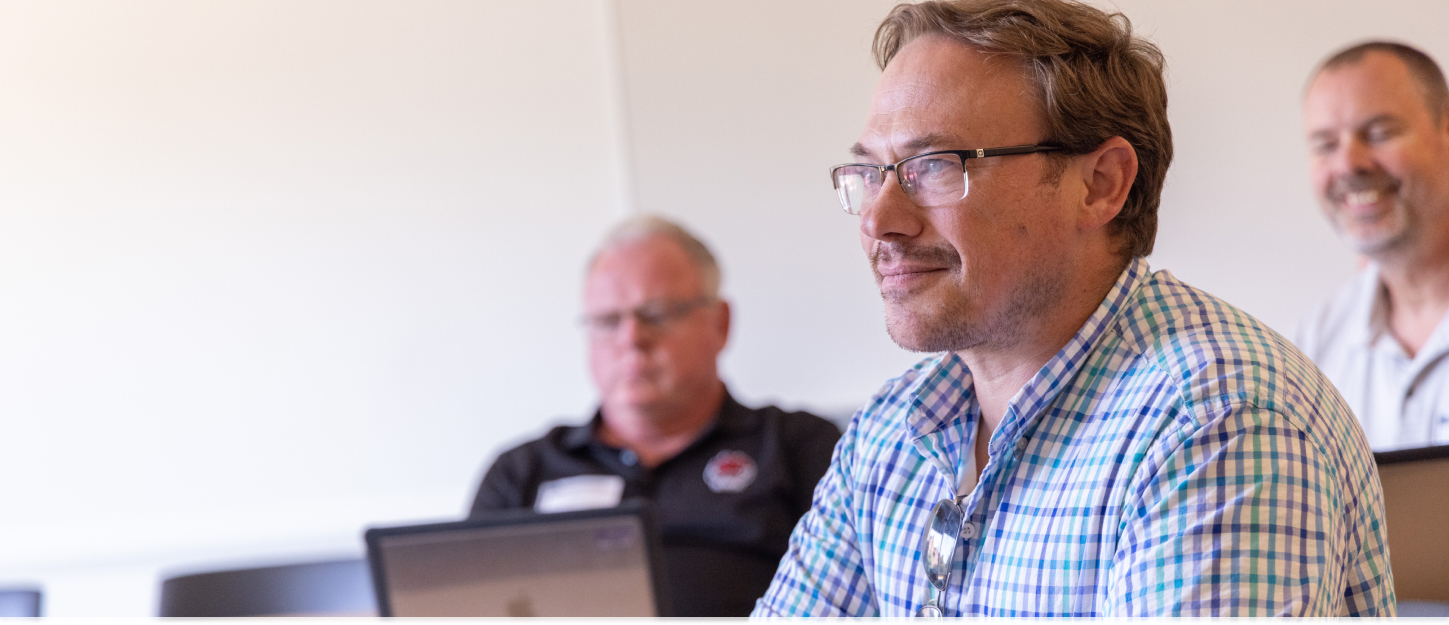 professionals smilling in a classroom
