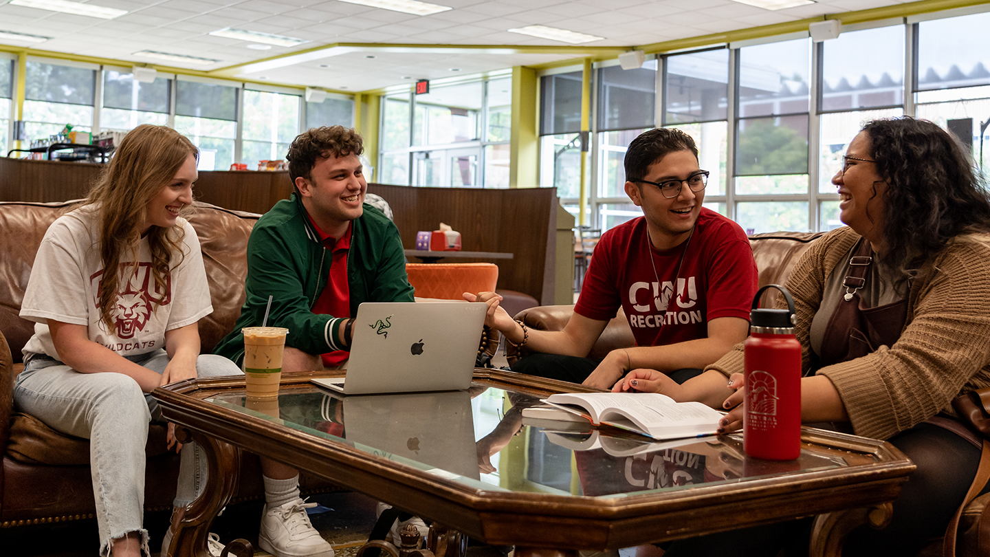 Students sitting around a table chatting