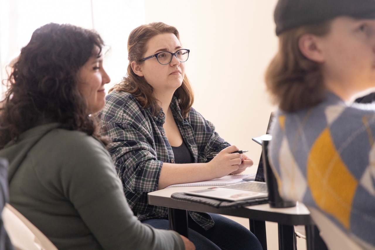Student watching a lecture during their philosophy class