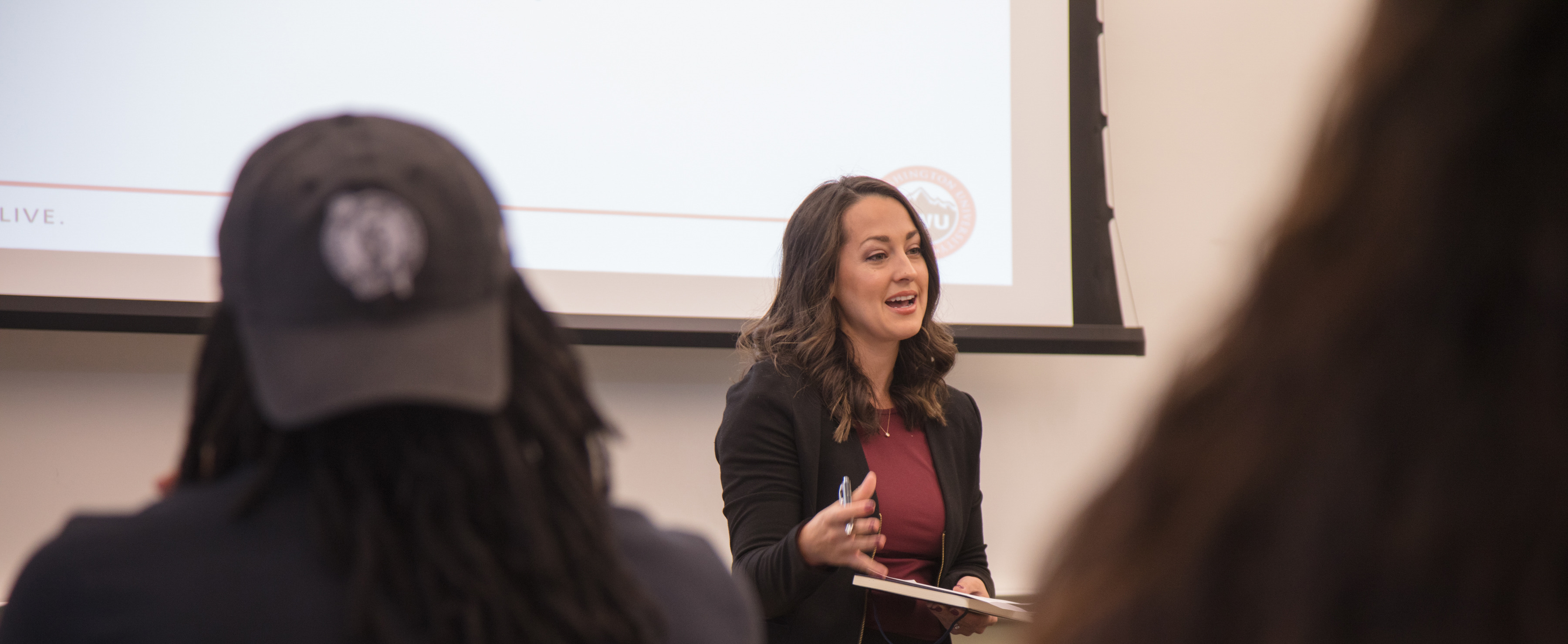 Professor lecturing in front of a classroom