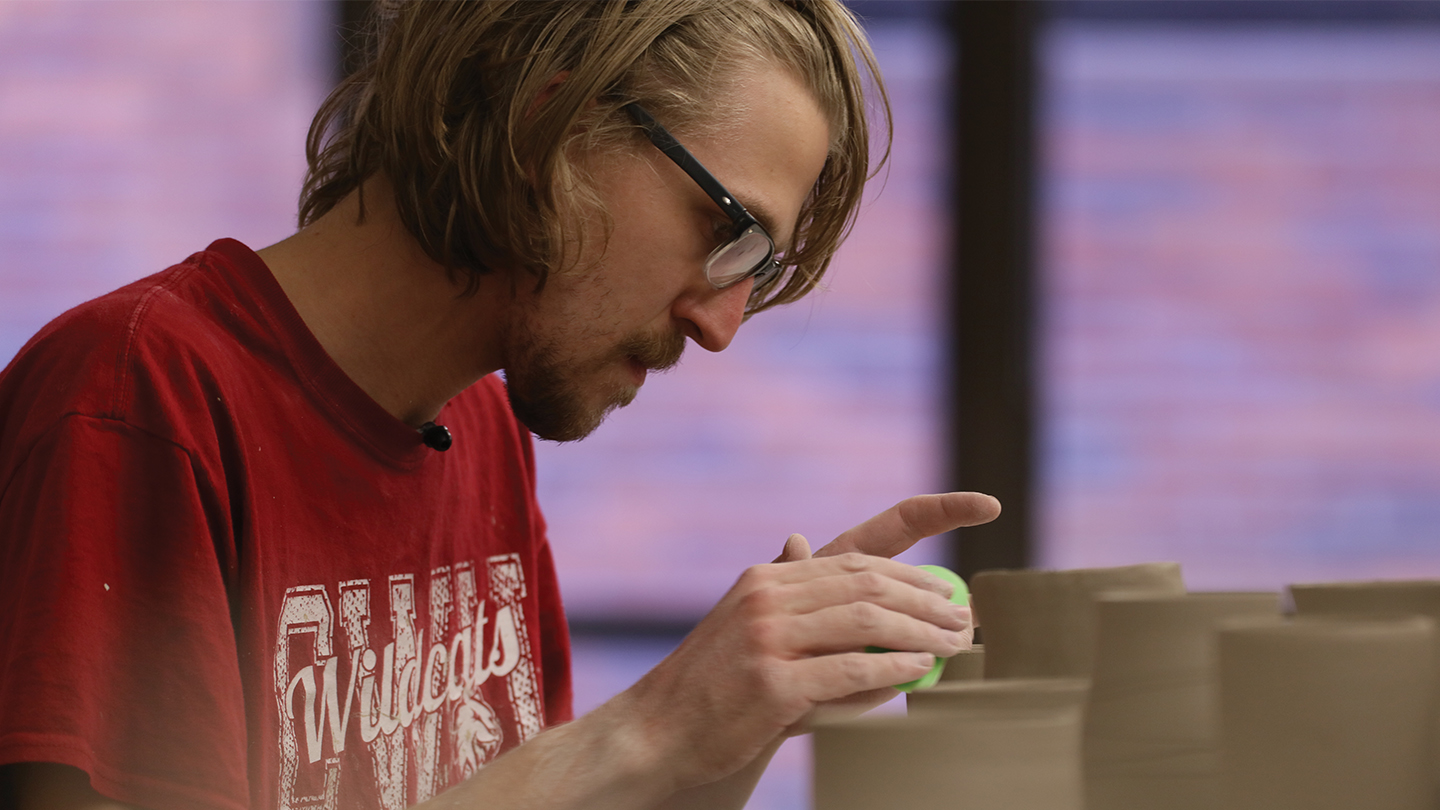 Student using clay