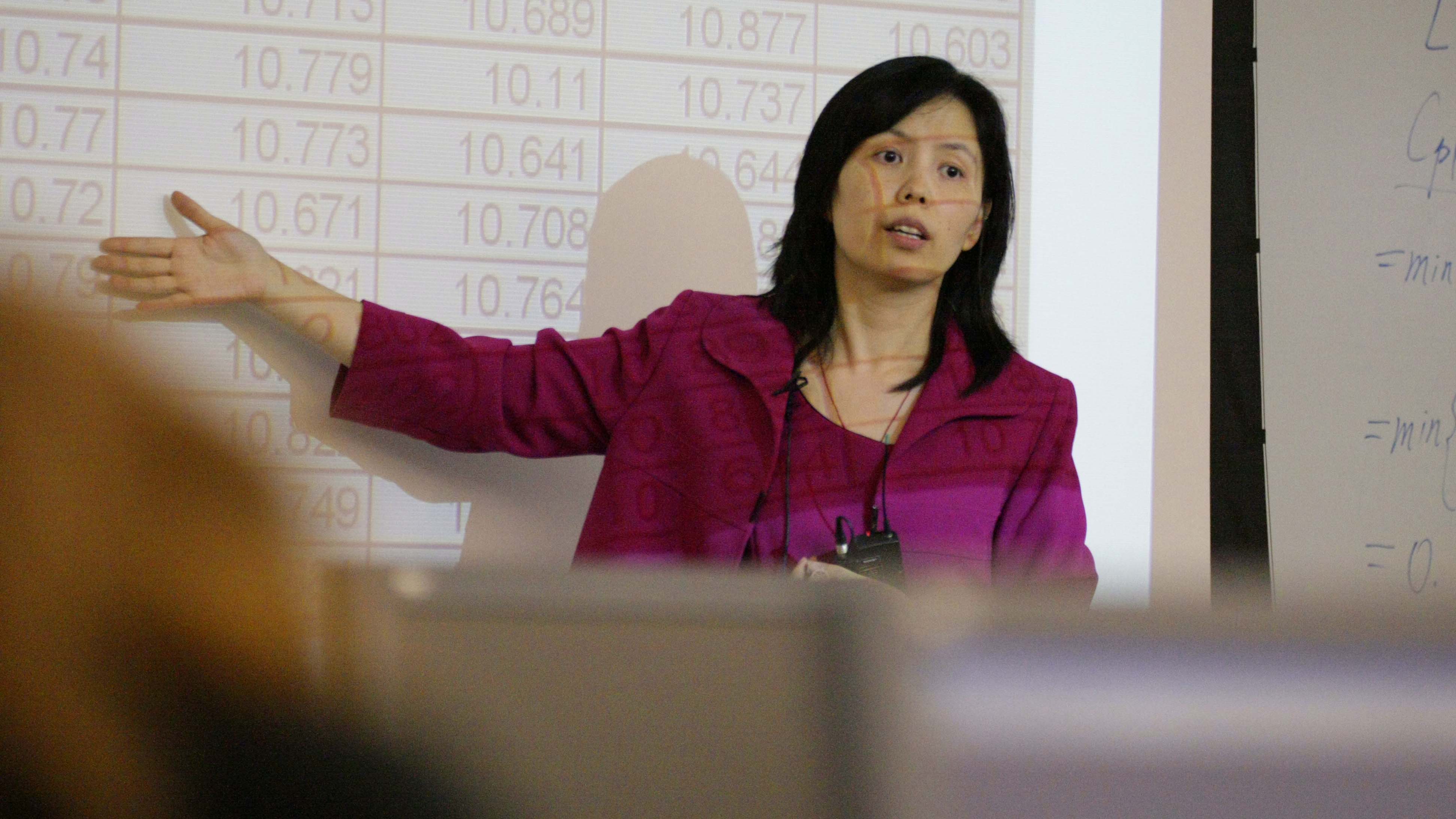 Professor speaking in front of a classroom