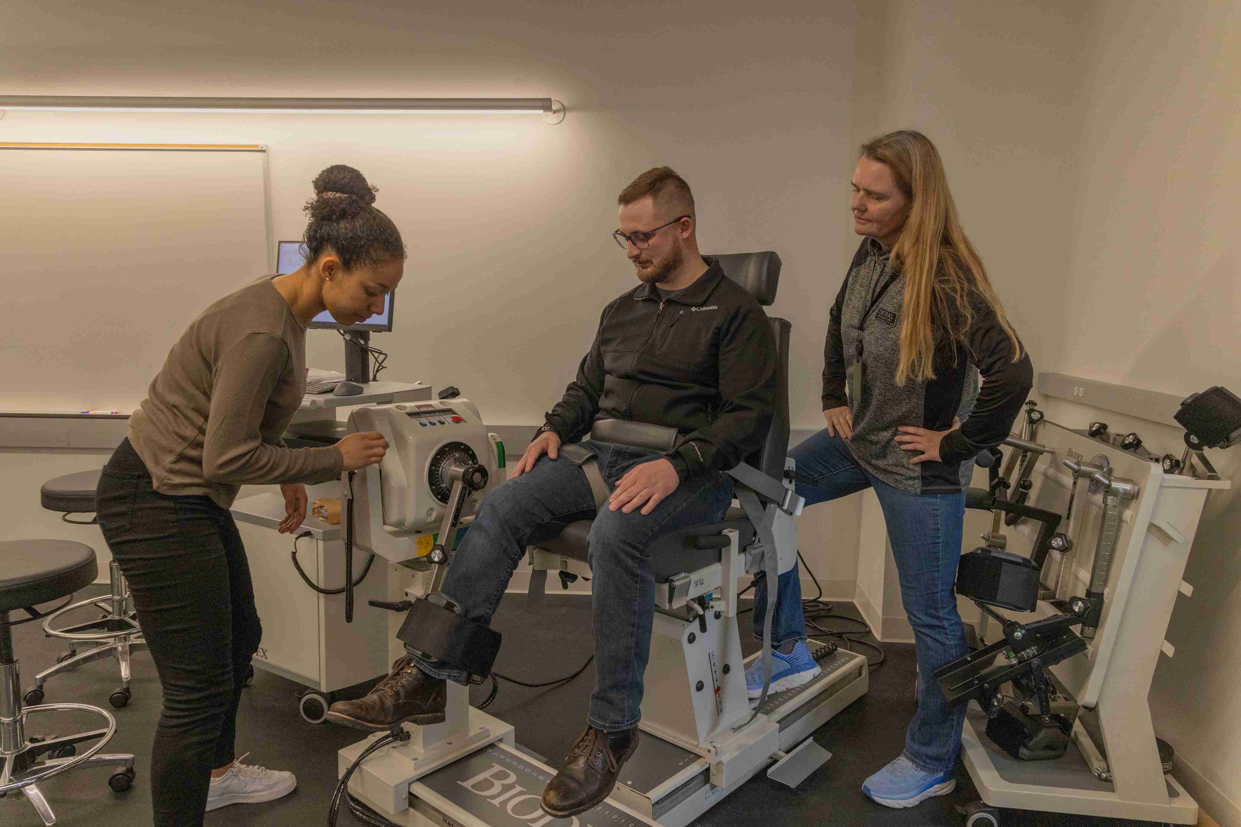 clinical physiology students using equipment