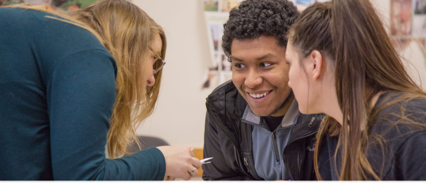 Professor working with two students