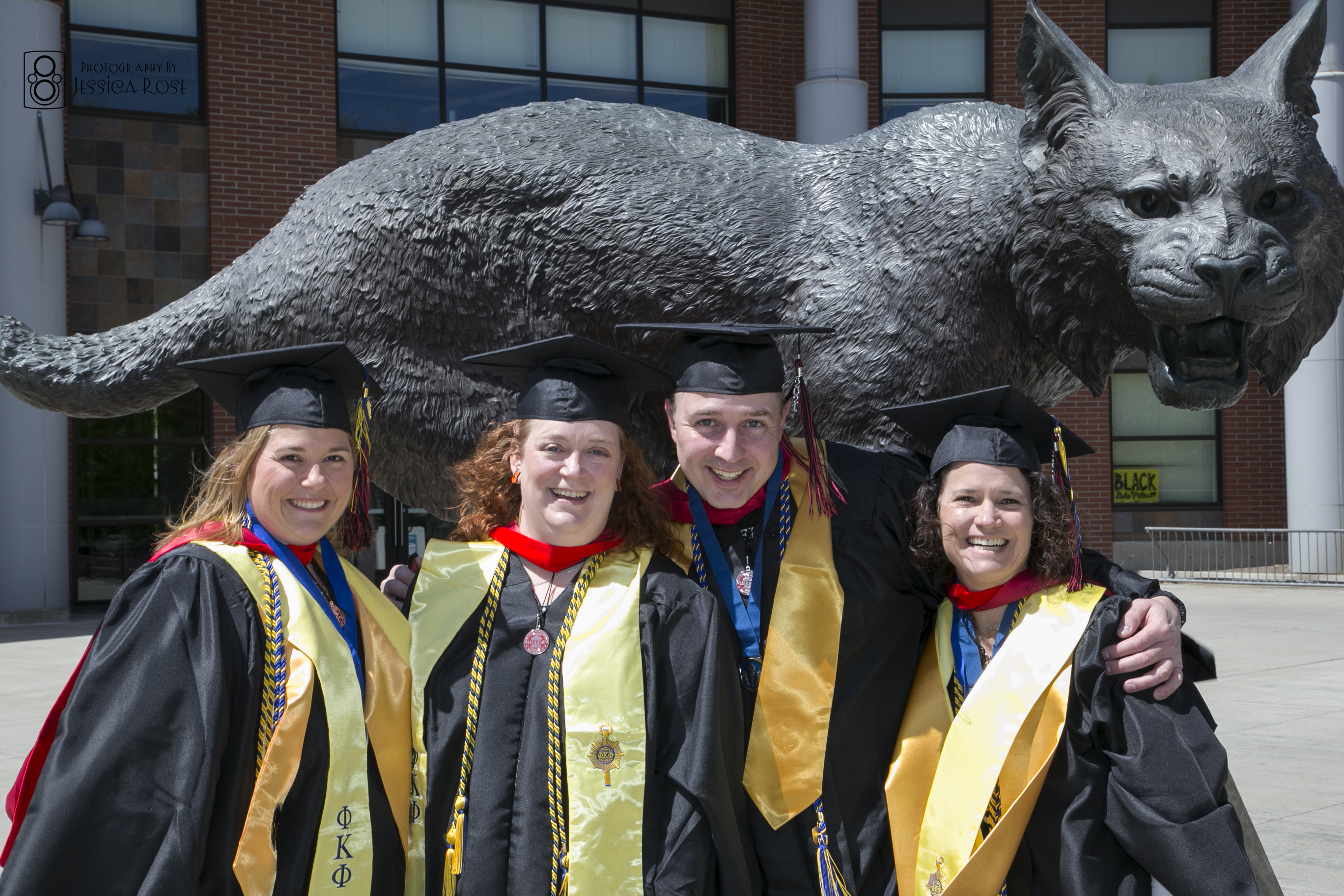 students-grad-group-statue.jpg