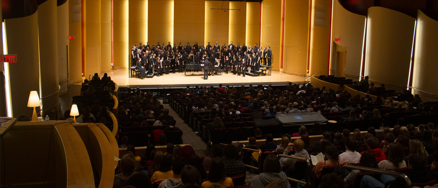 Choir singing on the concert hall stage during a past festival.