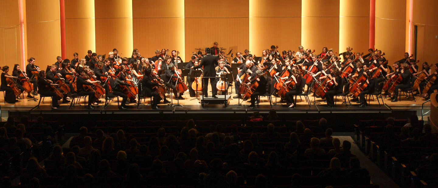 Mass cello ensemble performing in final concert of the cello celebration.