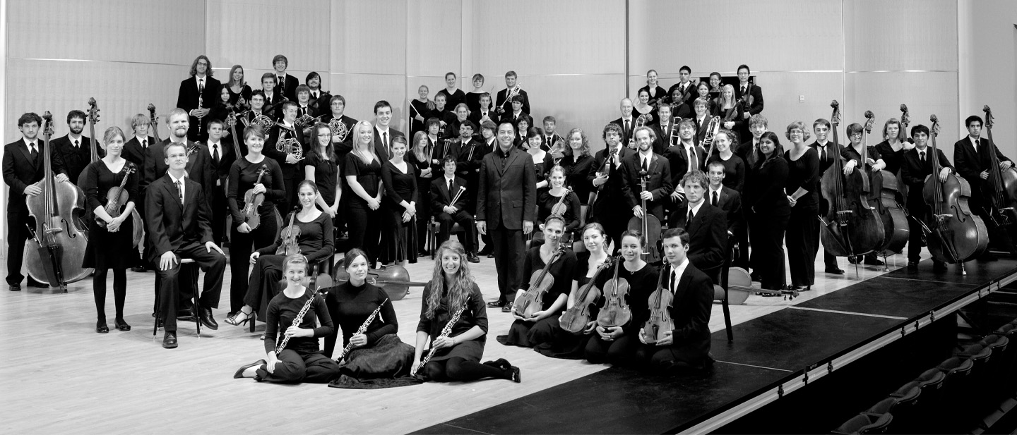 Formal image of the CWU orchestra on the concert hall stage. 