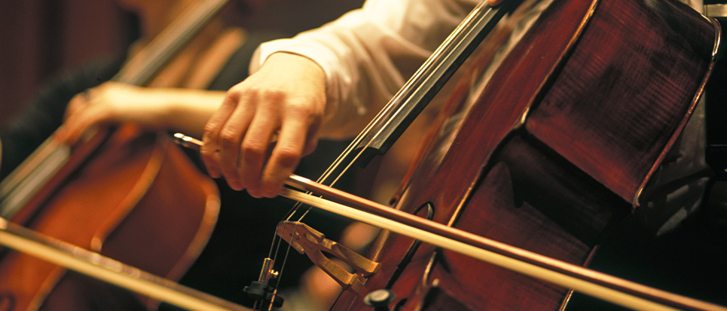 Closeup image of a cello being bowed.