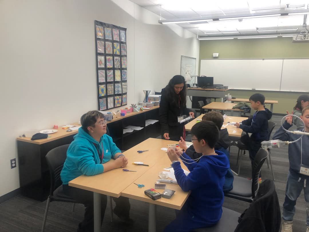 Intern working with math circle student