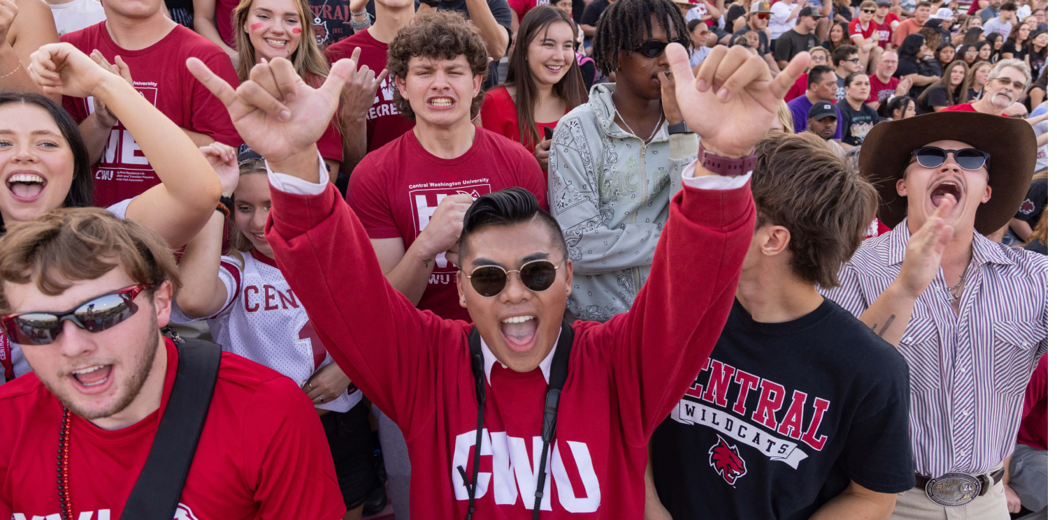 Students cheering in the crowd.