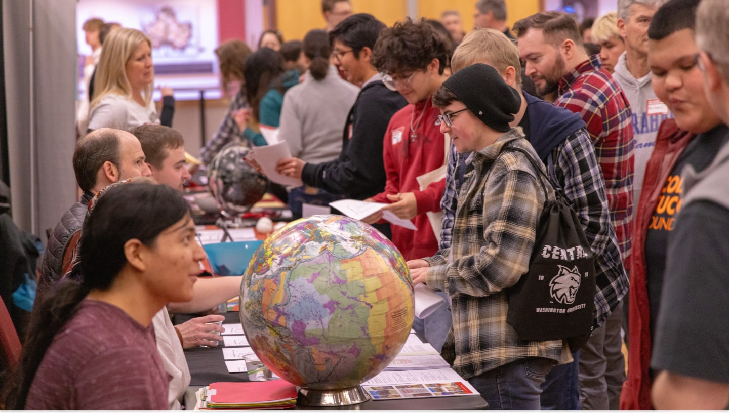 Students and families browsing departments at Wildcat Preview Day.