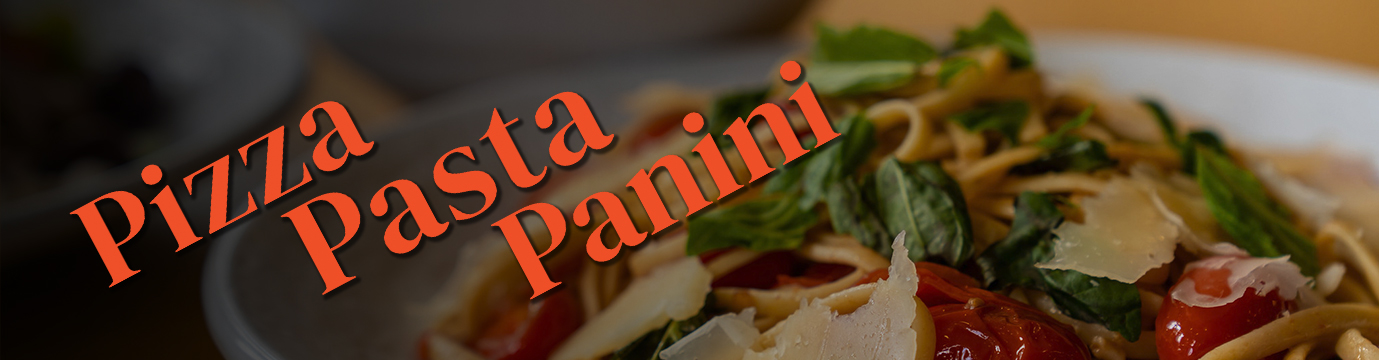 A delicious plate of pasta with fresh basil and shaved parm.