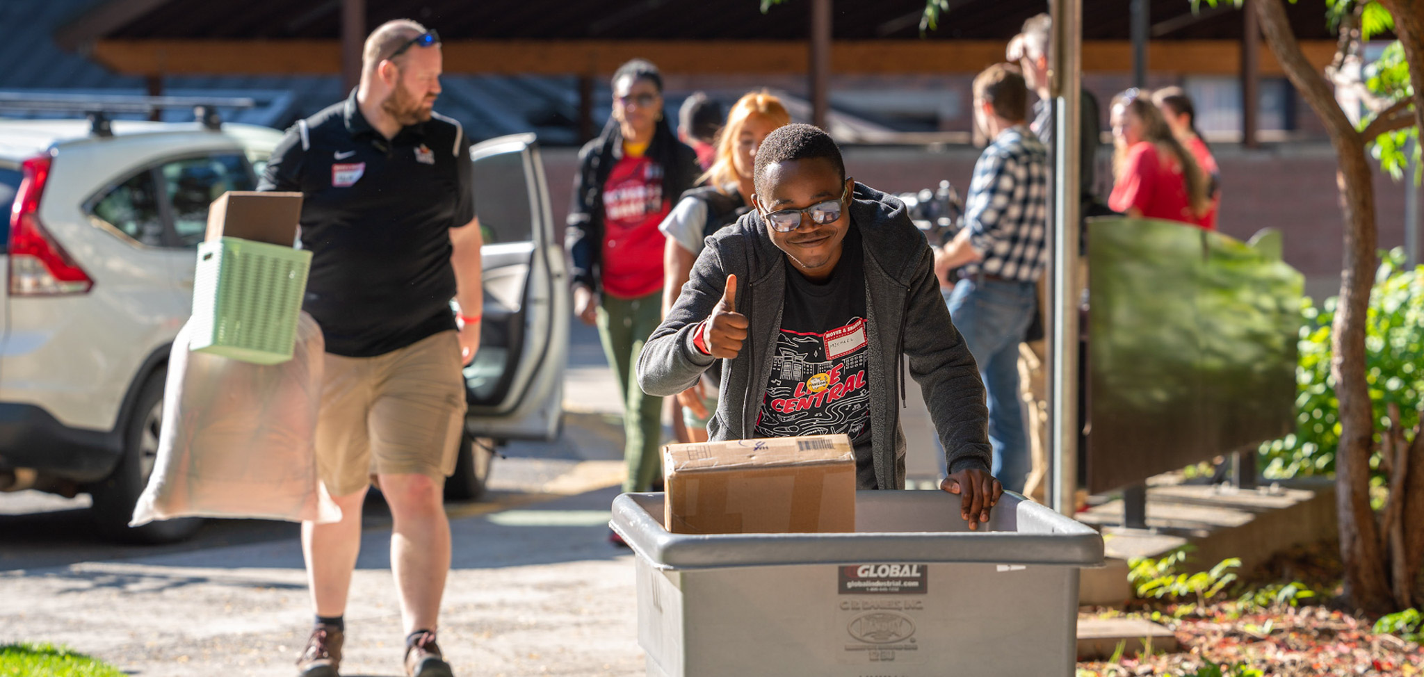 Student moving in with large rolling bin